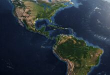 Satellite view of the Americas, showing landmasses, oceans, and some cloud cover.