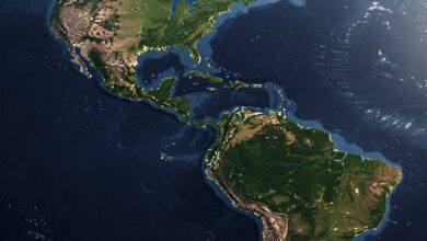 Satellite view of the Americas, showing landmasses, oceans, and some cloud cover.