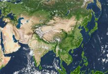 Satellite view of Asia showing landmasses, bodies of water, and cloud cover.